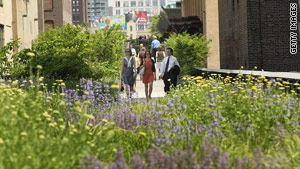Visitors explore the newly opened second section of New York's High Line park.