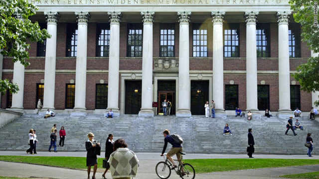 Students pass in front of Harvard's Widener Library in Cambridge, Massachusetts.