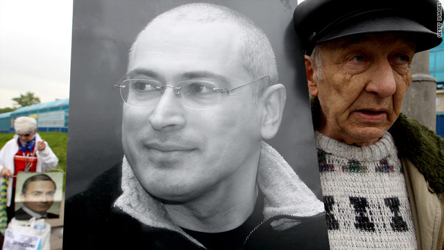 A supporter of Mikhail Khodorkovsky, imprisoned in Russia for eight years, holds his portrait outside a court in Moscow recently.
