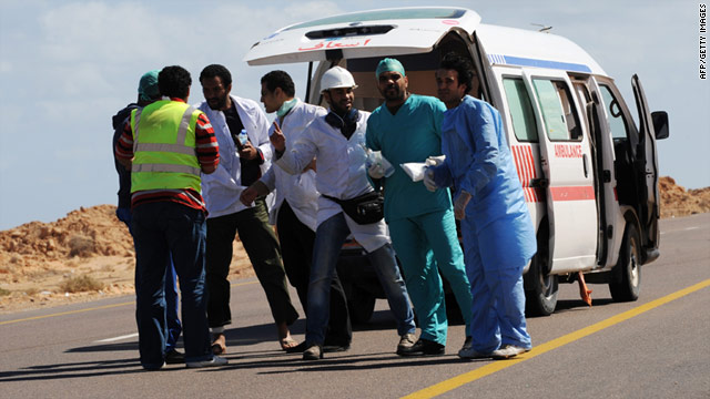 Libyan field medics try to reach wounded rebel fighters near the northern town of Bin Jawad in March.
