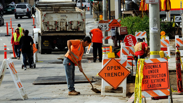Workers repair the sidewalk in a Recovery Act project last year in Los Angeles.