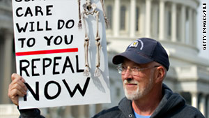 A demonstrator at a rally in Washington in November carries a sign calling for repeal of health care legislation.