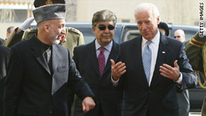 Afghan President Hamid Karzai and U.S. Vice President Joe Biden chat Tuesday during Biden's visit to Kabul.