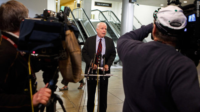 Sen. John McCain talks with reporters after a closed committee meeting with the Pentagon on Libya.