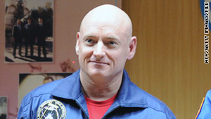 Astronaut Scott Kelly poses for pictures in October before leaving for the international space station.