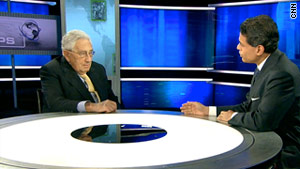 Former U.S. Secretary of State Henry Kissinger, left, talks to CNN's Fareed Zakaria on Sunday.