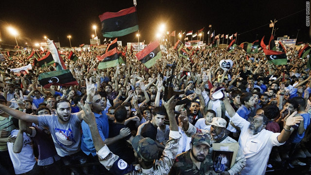 Thousands of Libyan rebels in the eastern stronghold of Benghazi celebrate the rebel incursion in the capital, Tripoli.