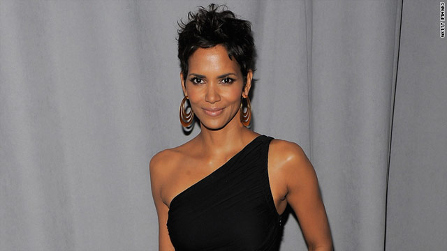 Off-duty officers hired by Halle Berry called police Monday and said they were holding a burglary suspect at her home.