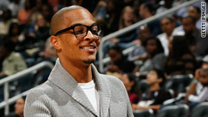 Rapper T.I. looks on during a game between the Miami Heat and the Atlanta Hawks at Philips Arena in October 2010.