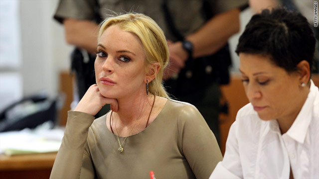 Lindsay Lohan attends a hearing Thursday with her attorney, Shawn Chapman Holley, in a Los Angeles courtroom.