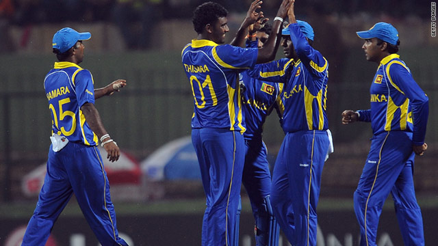 Sri Lanka's players celebrate reaching the 2011 Cricket World Cup quarterfinals with victory over Zimbabwe.