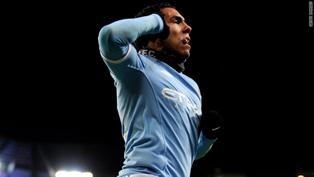 Carlos Tevez celebrates after putting Manchester City ahead in the FA Cup replay against Leicester on Tuesday.
