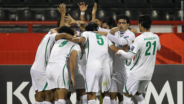 Iraq players celebrate the goal that secured their place in the last eight of the Asian Cup.