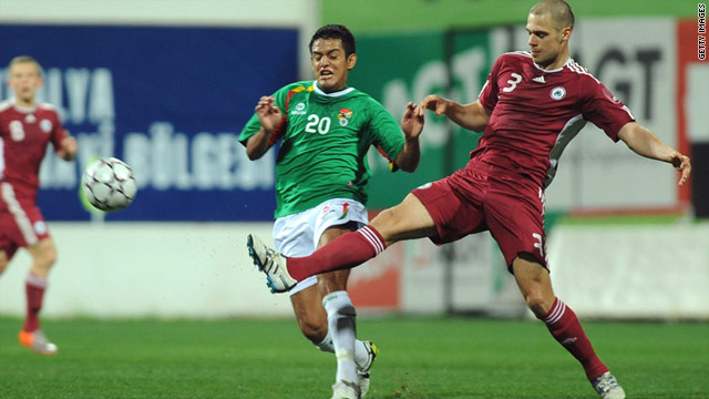 Latvia's Oskars Klava, right, vies for the ball with Jhasmany Campos of Bolivia during last week's friendly in Turkey.