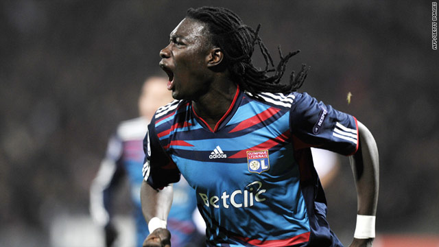 Bafetimbi Gomis made amends for a glaring first-half miss with an 83rd-minute goal to give Lyon a 1-1 draw with Real Madrid.