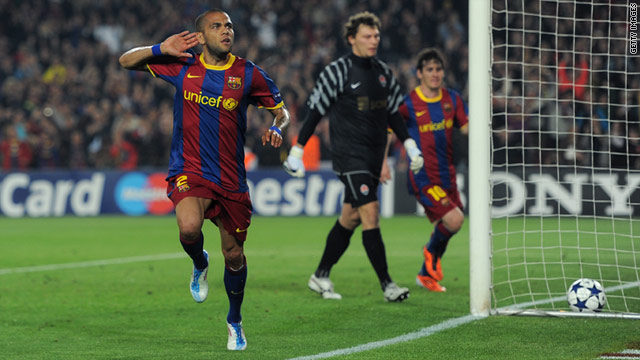 Daniel Alves celebrates after putting Barcelona 2-0 up in the first half against Shakhtar Donetsk in the Camp Nou.