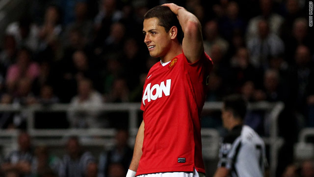 Javier Hernandez holds his head after being booked for diving during the final moments against Newcastle United.