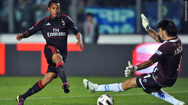 AC Milan striker Robinho slots the winning goal past Brescia goalkeeper Michele Arcari on Saturday.