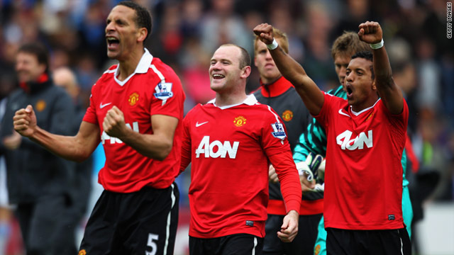 Captain Rio Ferdinand, left, goalscorer Wayne Rooney, center, and Nani celebrate Manchester United's title triumph.