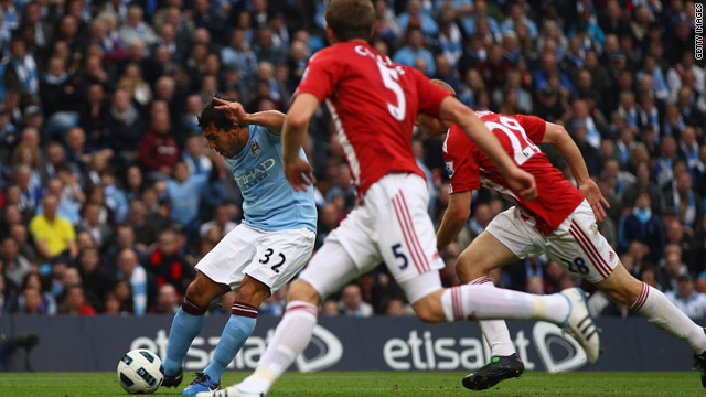 Carlos Tevez fires Manchester City into the lead against Stoke in their English Premier League encounter.