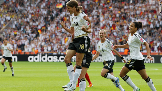 Kerstin Garefrekes (far left) celebrates Germany's opening goal in their 2-1 World Cup victory over Canada.