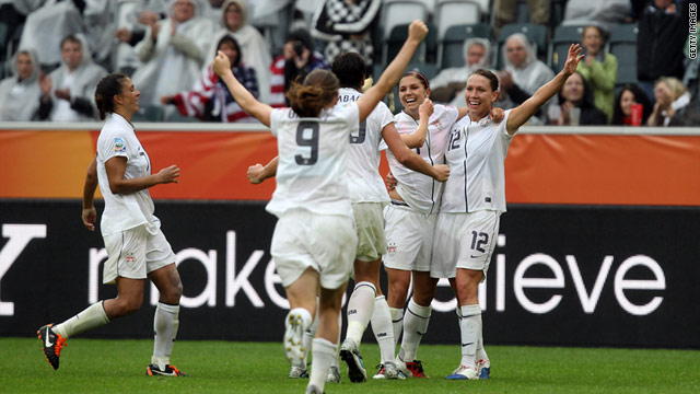 The U.S. women celebrate Alex Morgan's goal in the 3-1 win over France.