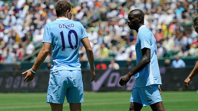 Edin Dzeko (left) reacts angrily after Mario Balotelli (right) wastes a good opportunity in City's match with Los Angeles Galaxy.