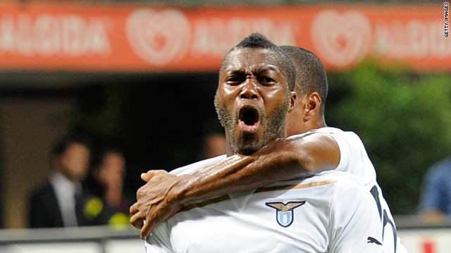 Djibril Cisse celebrates scoring Lazio's second goal, but Milan fought back to earn a 2-2 draw at the San Siro.