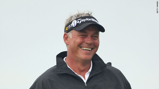 Darren Clarke is all smiles as he stands just 18 holes away from a famous British Open victory.