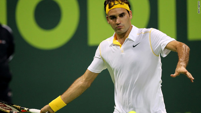 Roger Federer plays a forehand return during his victory over Serbia's Viktor Troicki.