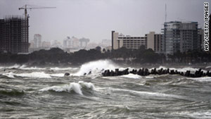 RagingwaveswhippedupbyHurricaneIrenebattertheseafrontinSantoDomingo,DominicanRepublic,onTuesday.