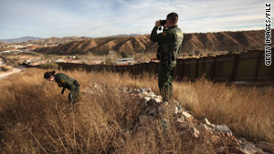 U.S. Border Patrol agents monitor the U.S.-Mexico border on in December 2010 near Nogales, Arizona.