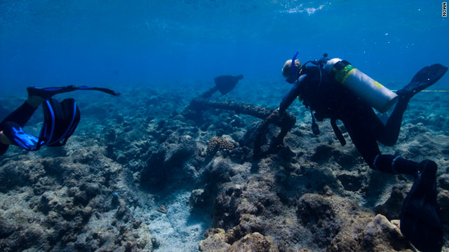 Divers explore the debris field left by the 1823 sinking of the Two Brothers whaling ship, off French Frigate Shoals.