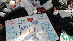 Fans left rolls of toilet paper and signs beneath the Toomer's Corner oaks in Auburn, Alabama.