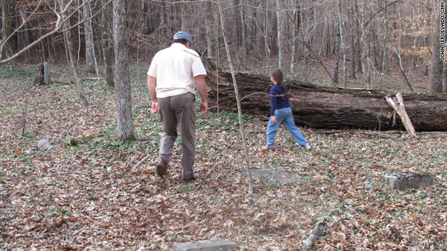 Duncan Shropshire and daughter Mia-Grace explore the grounds where their ancestors are buried.