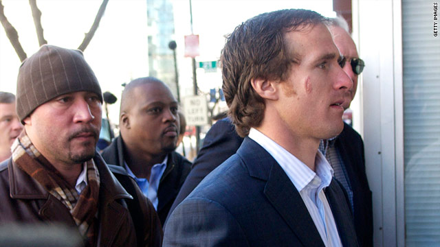 New Orleans Saints' quarterback Drew Brees, a player's representative, walks into a meeting with a mediator on Thursday.