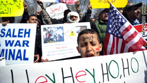 Yemenis shout slogans against Yemen's President Ali Abdullah Saleh Saturday in front of the White House.