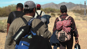 Undocumented immigrants walk in Arizona's Sonoran Desert after illegally crossing the U.S.-Mexico border on January 19.