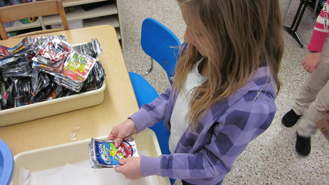 Gabby Truppelli, a fifth grader at East Amwell School in New Jersey, sorts juice pouches, which will be recycled into tote bags.
