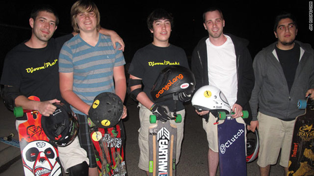 Skaters Ryan Lowery, Parker Sands, Brandon Lowery, Brandon Pippert, and Ara Sarkissian practice downhill long-board racing at night. (by Jim Roope/CNN)