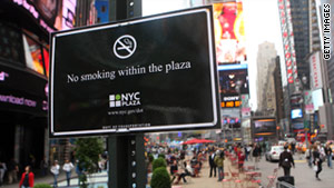 A no smoking sign is posted in the pedestrian plaza in Times Square.