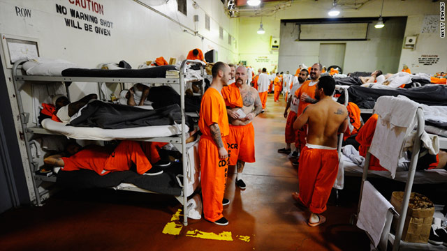 Inmates at Chino State Prison, which houses 5,500 inmates, crowd around the double and triple bunk beds.