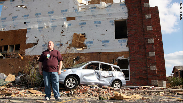 Stephen McCullough, a crisis counselor in Joplin, Missouri, shows where a car flew into the side of the building where he lived.