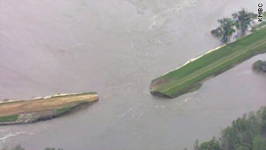 Two levees along the Missouri River broke Monday near the Iowa-Missouri border, officials said.