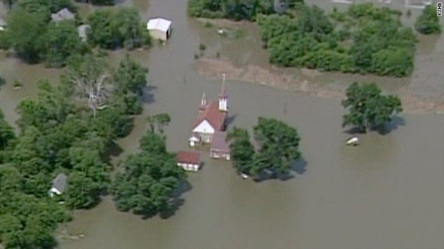 The Missouri River broke through levees at two points early Sunday, causing more resident evacuations.