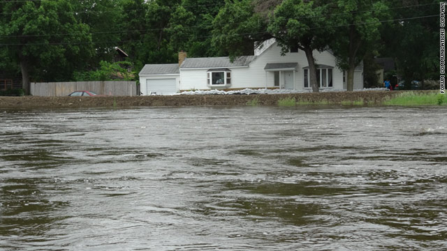 The swollen Souris River flows straight through Minot and is expected to overwhelm area levees.