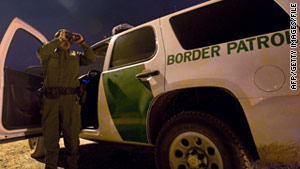 A Border Patrol officer searches for illegal immigrants in El Paso, Texas.
