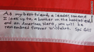 Kevin Gill wrote this note on an American flag signed by  Andrew Wilfahrt's comrades.
