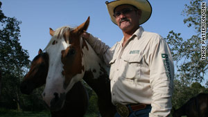 This summer's widespread Texas drought has browned rancher Scot Mitchell's grazing fields.