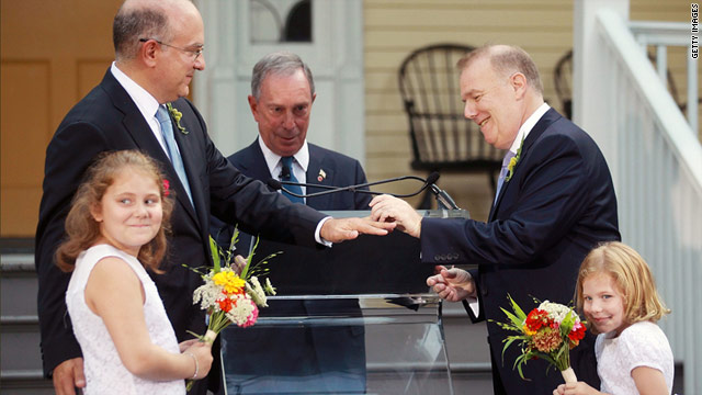 New York City Mayor Michael Bloomberg, center, officiates a same-sex marriage on Sunday.